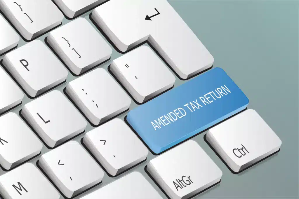 amended tax return written on the keyboard button
