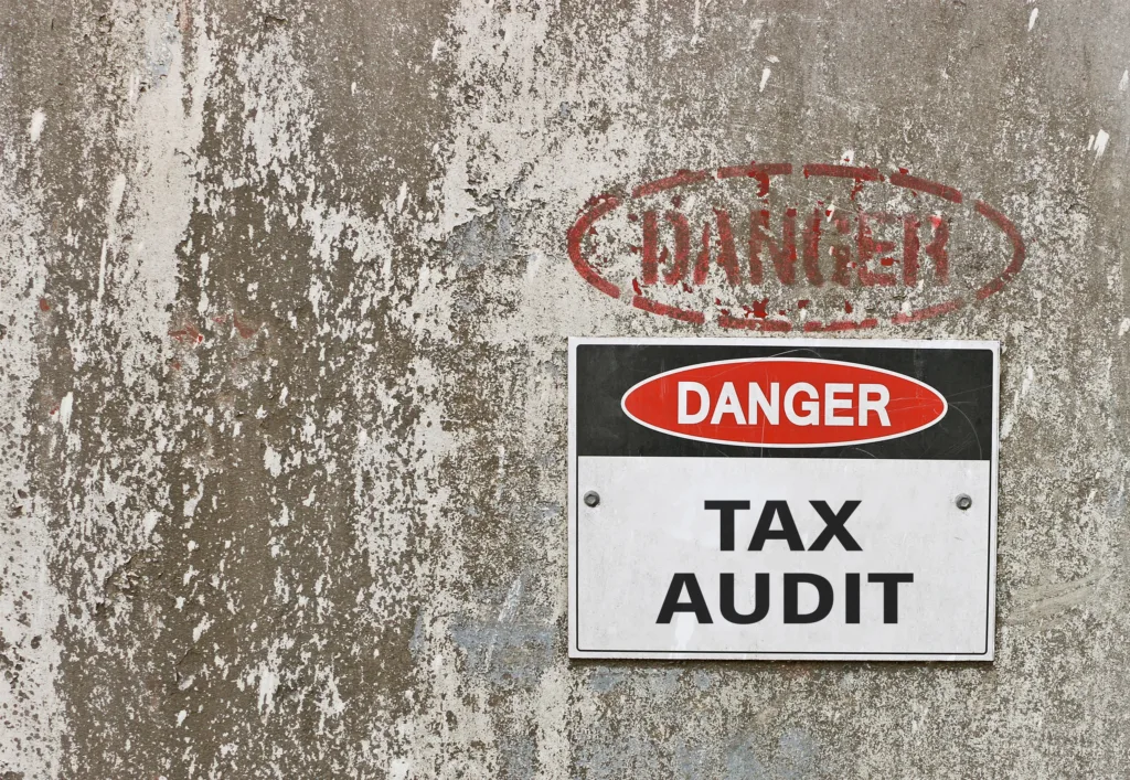 red, black and white Danger, Tax Audit warning sign